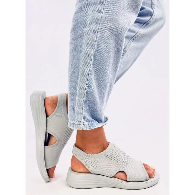 Grey soft cut-out sandals by Aldo.