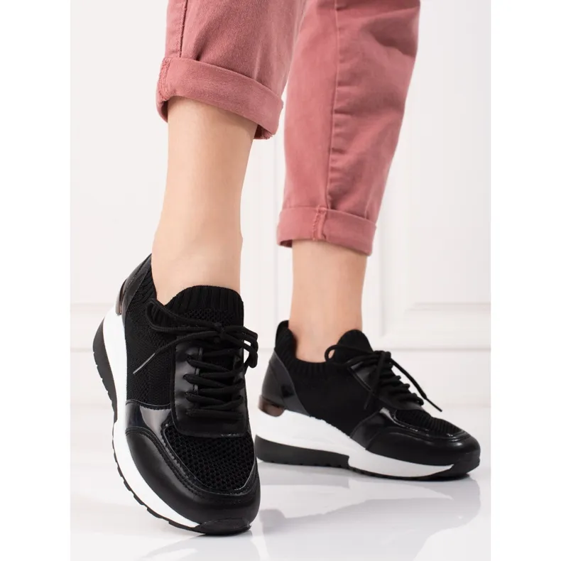 Black women's soft high-top sneakers.