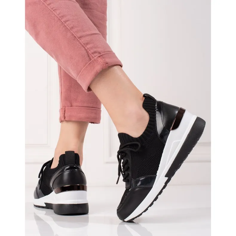 Black women's soft high-top sneakers.