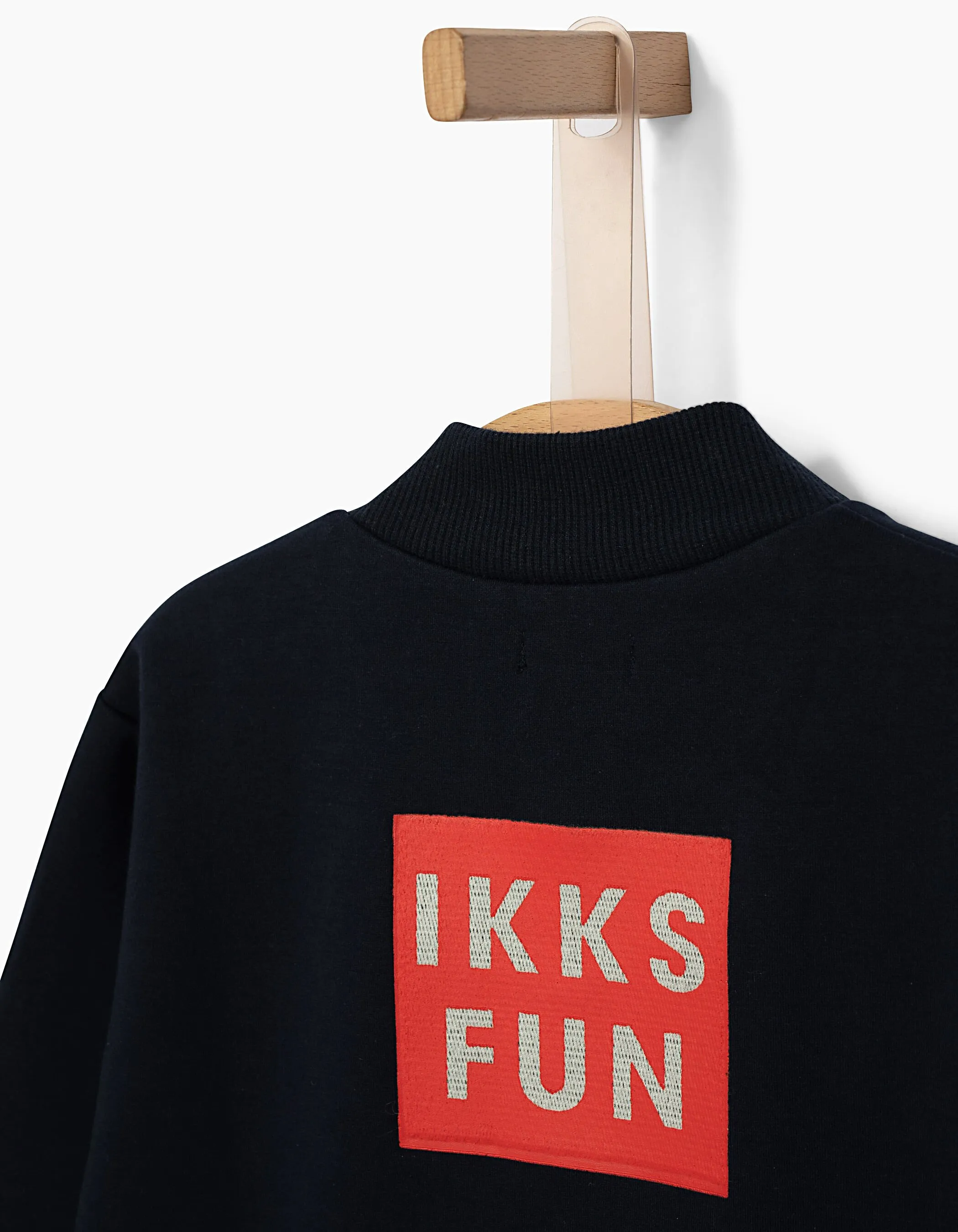 Cardigan bomber jacket in navy blue for boys by IKKS with fun design on the back.