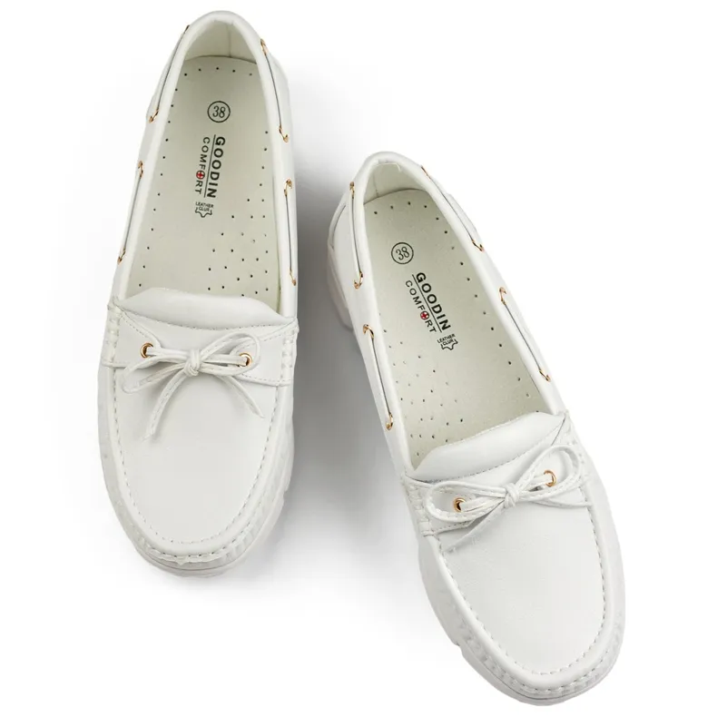 Comfortable white women's moccasins.