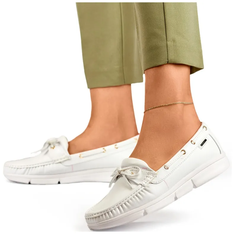 Comfortable white women's moccasins.