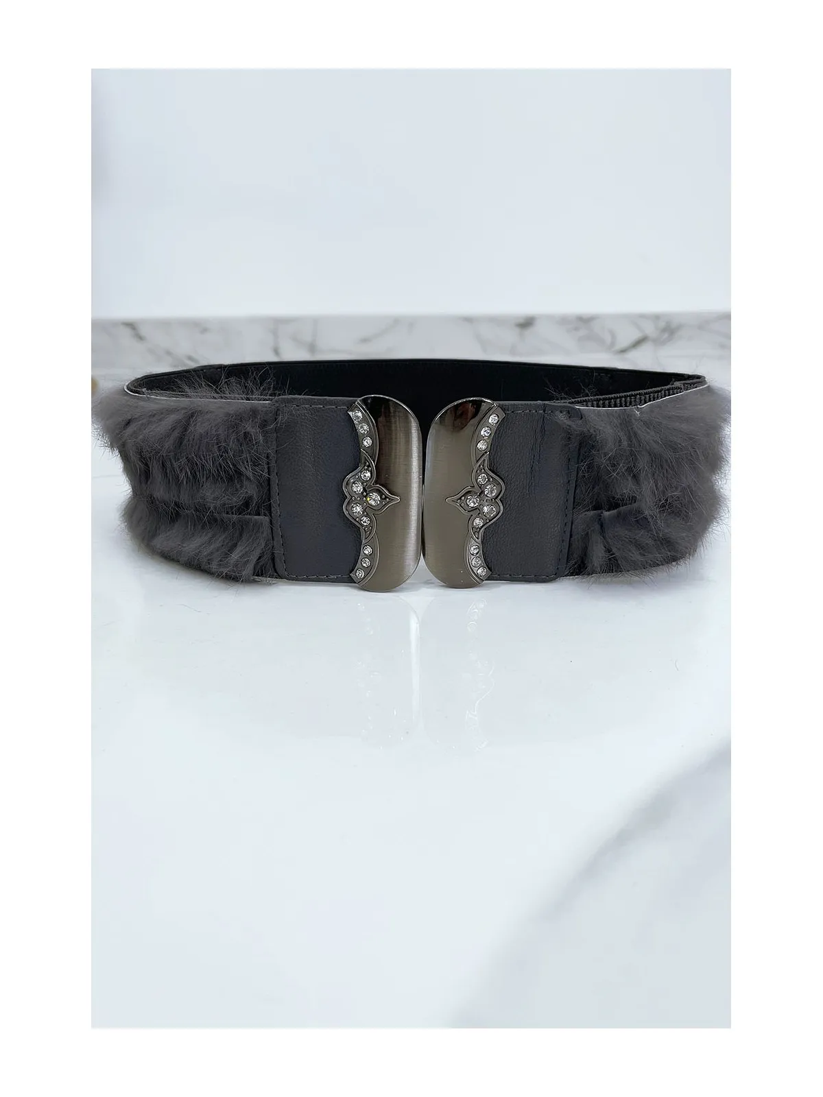 Gray Elastic Belt with Accessory and Feather.