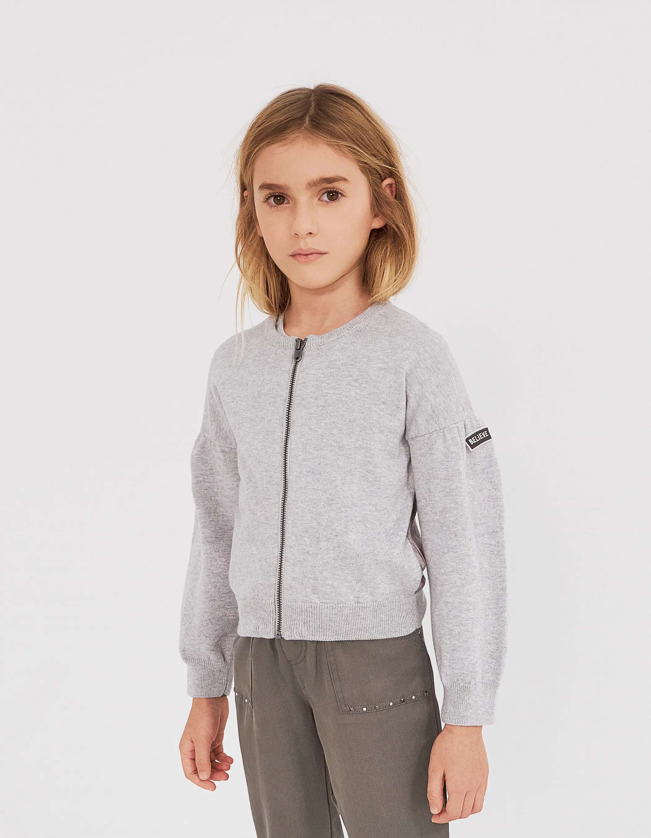 Gray heathered dual-material zip-up cardigan for girls.