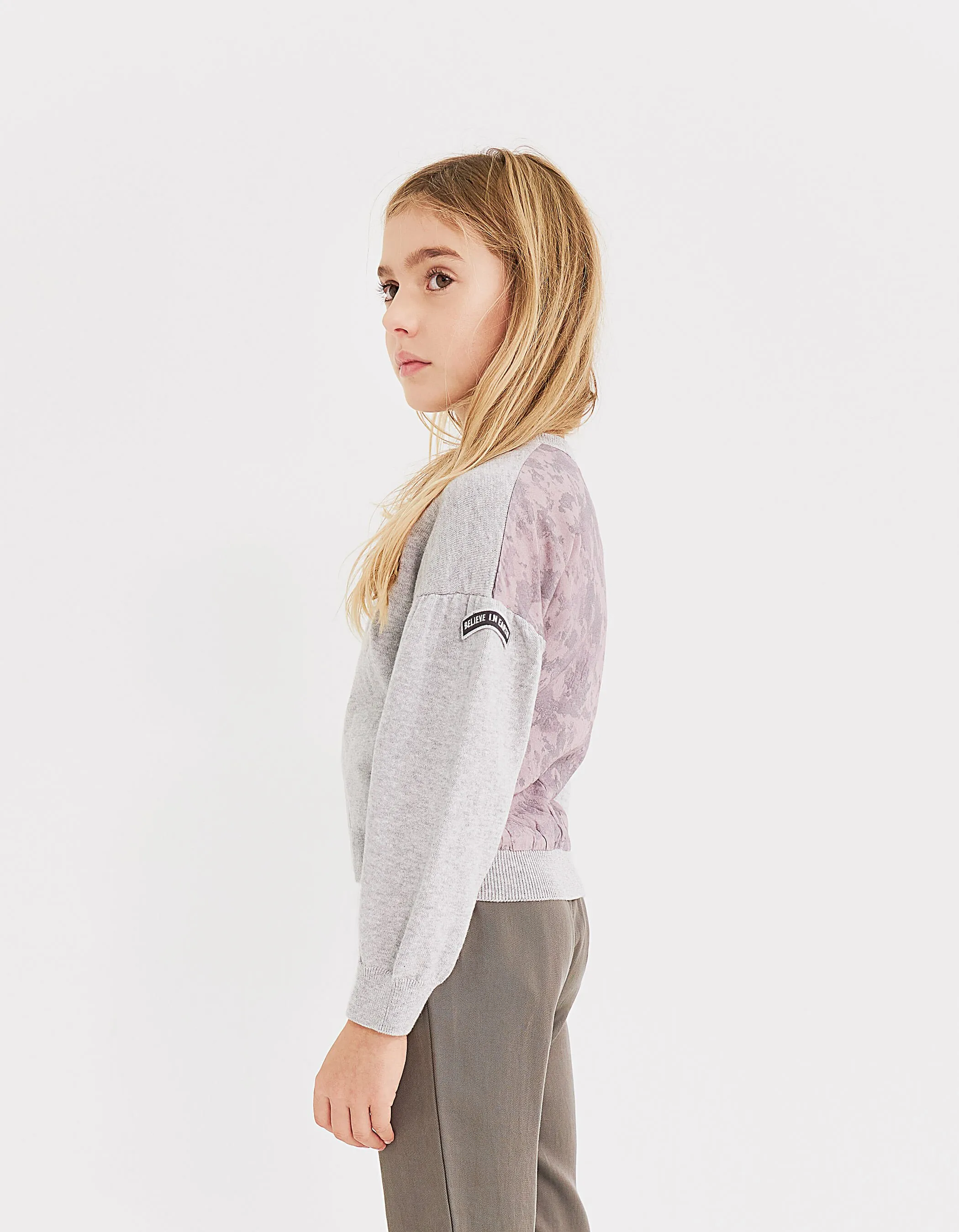 Gray heathered dual-material zip-up cardigan for girls.