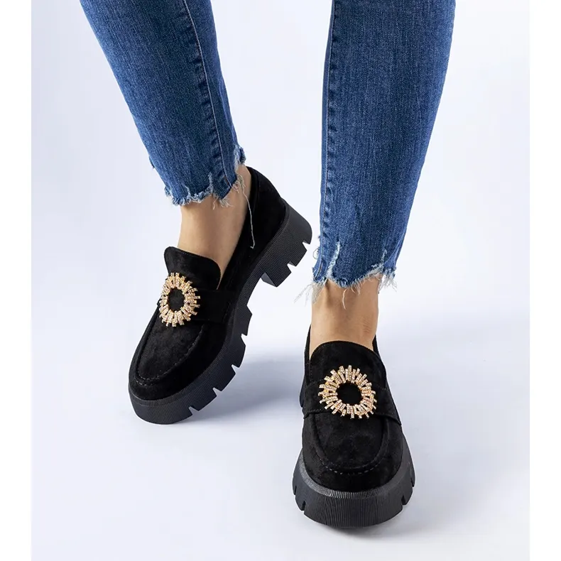 Black loafers embellished with a black Stanislas buckle