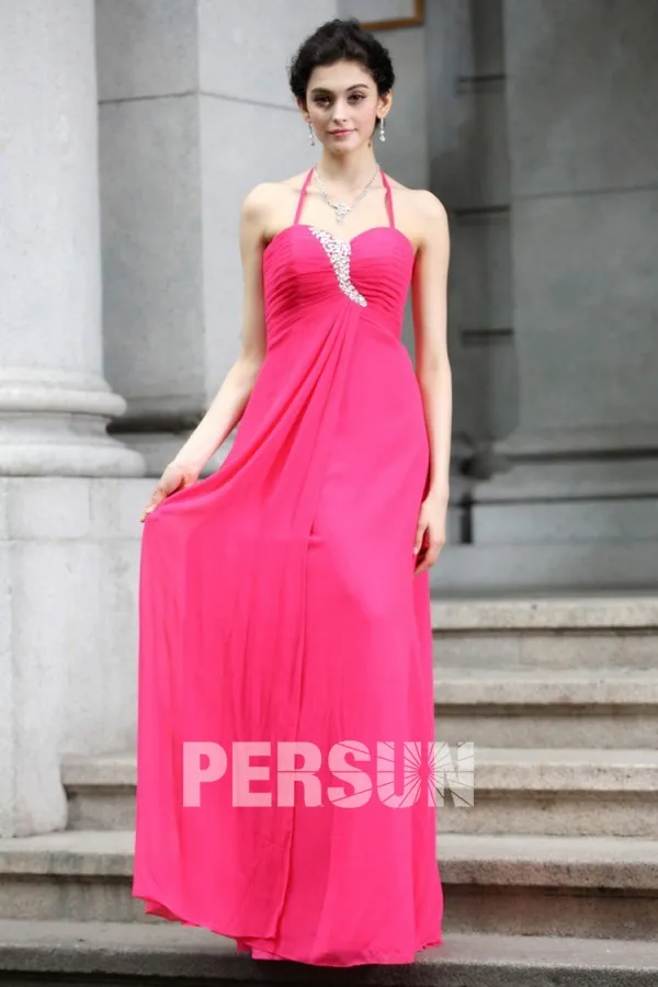 Simple evening gown with thin halter neck strap.