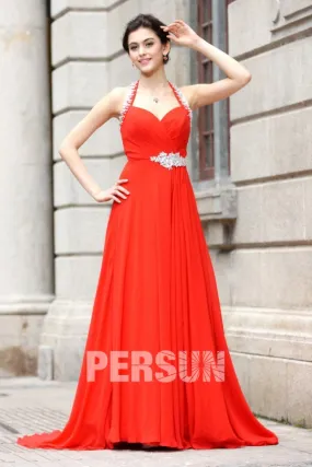 Long red dress with sweetheart neckline and halter strap.