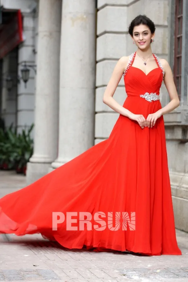 Long red dress with sweetheart neckline and halter strap.